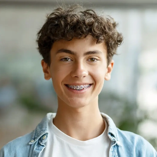 teen boy with braces smiling